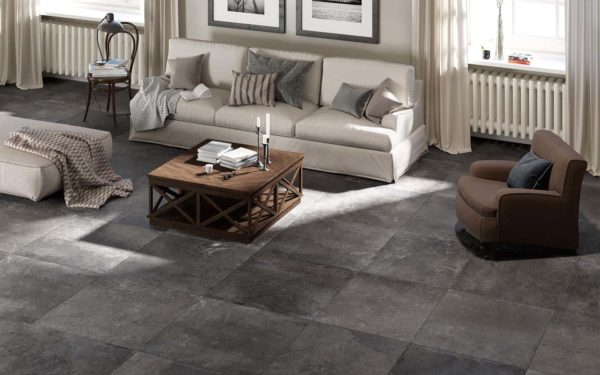 A designer living room with Dom Ceramiche Mas de Provence Coal tile