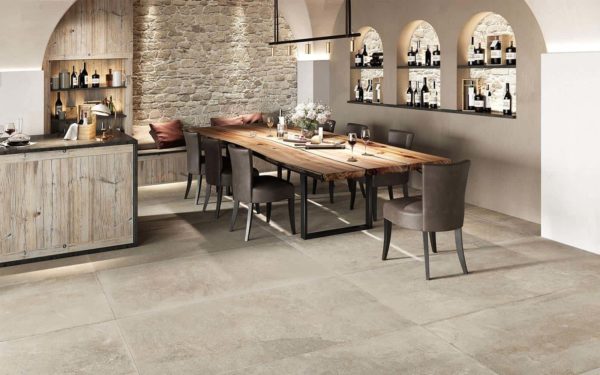 A rustic, designer dining room with Dom Ceramiche Mas de Provence Ecrú tile