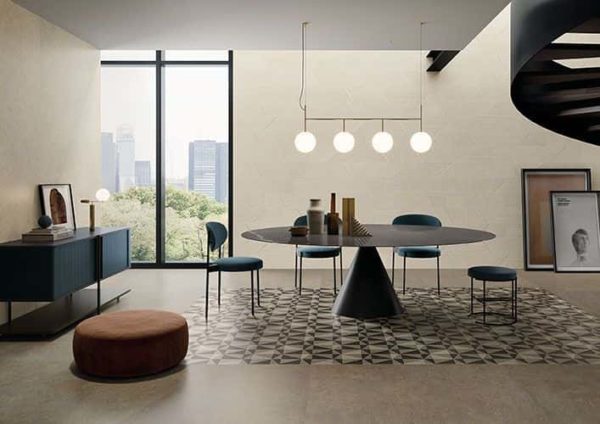 A minimalist dining area with floors and walls tiled with Silver Grain collection tile.